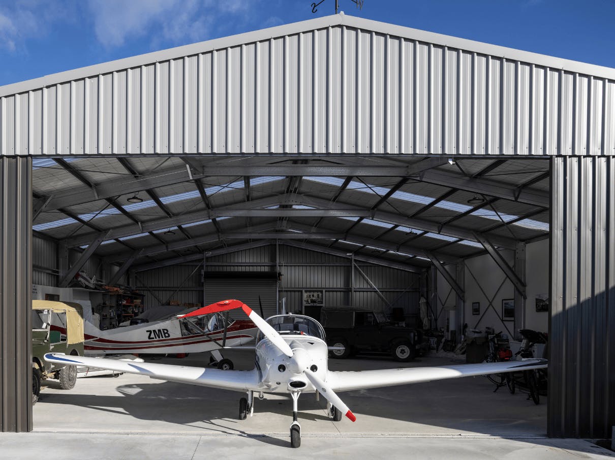 Hangar interior, plane and jeeps Hangar interior, plane and jeeps