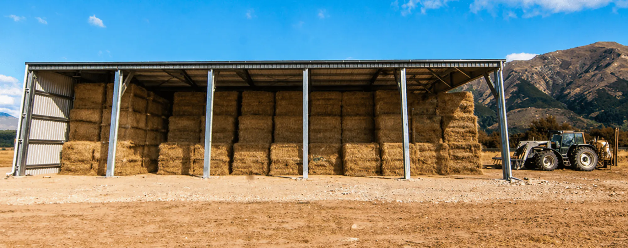 1.-NZ-Imagery Hero-Images Hero-Hay-Barn-with-Tractor