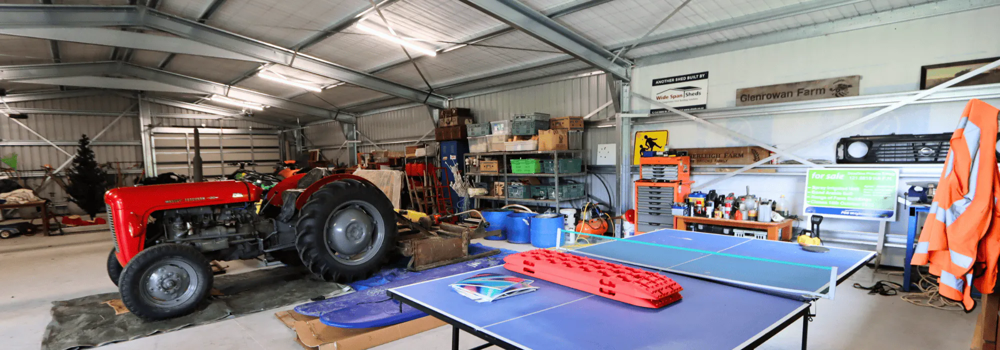 4 bay steel shed photo with table tennis table and tractor