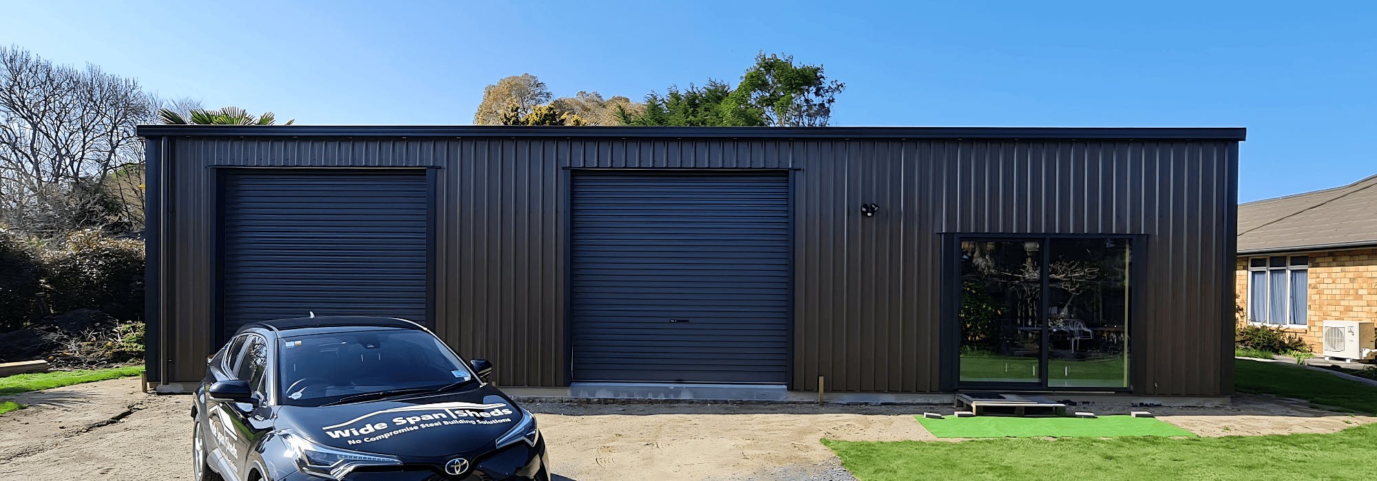 Outside photo of an Artists gable shed - Vehicle out front