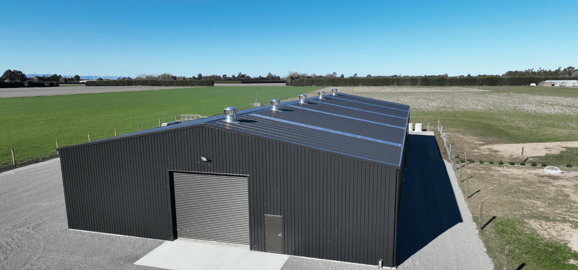 Large industrial rural contractors shed aerial photo