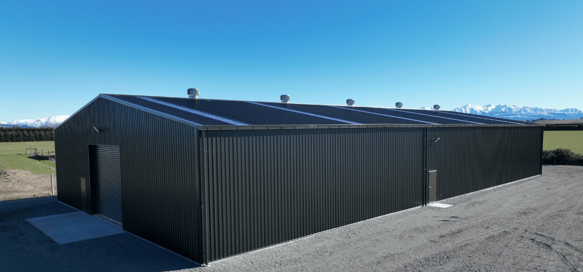 Large industrial rural contractors shed - side on view