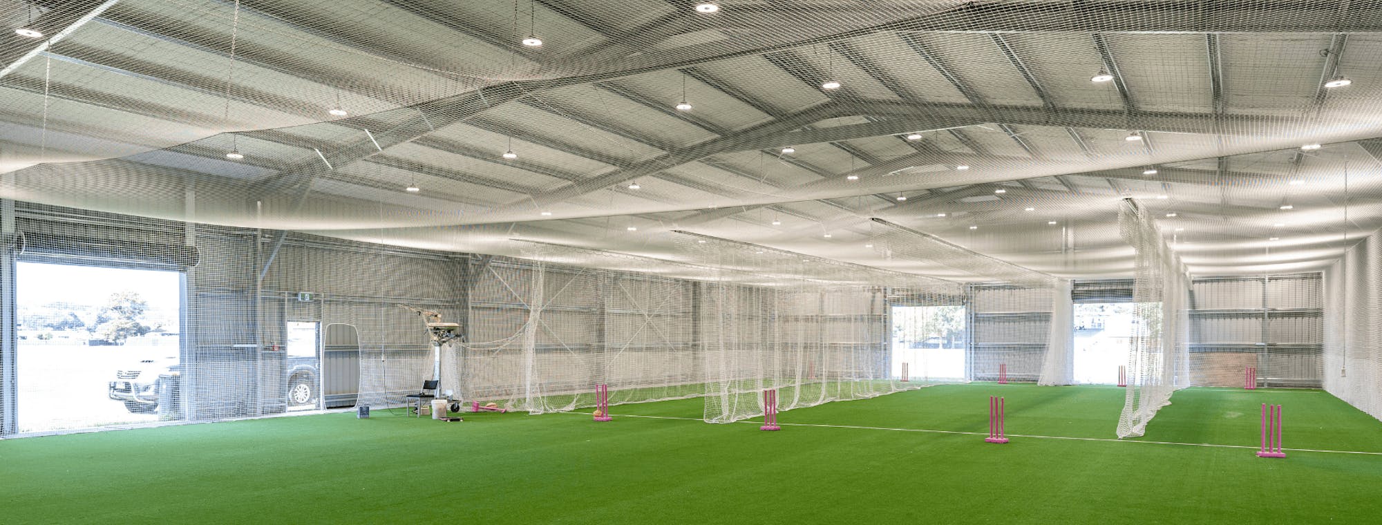 Cricket club community shed design interior with nets