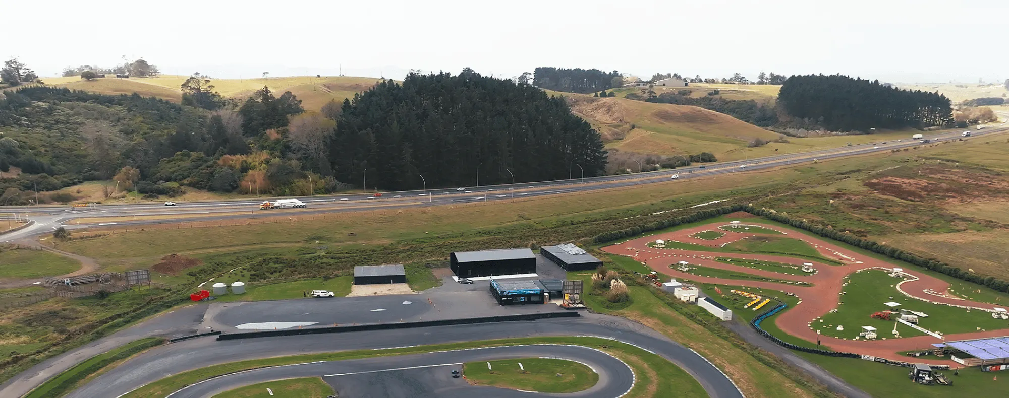 1.-NZ-Imagery Inspo-Gallery Meremere-Drift-Park Aerial-drift-track-with-shed