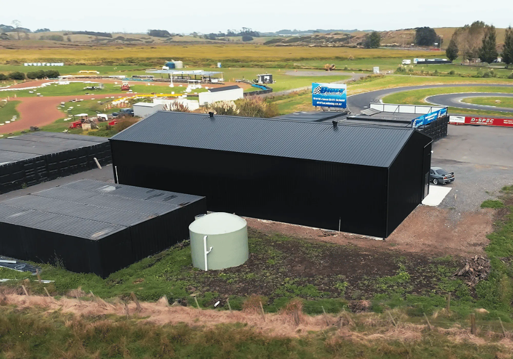 1.-NZ-Imagery Inspo-Gallery Meremere-Drift-Park back-of-industrial-shed-waikato