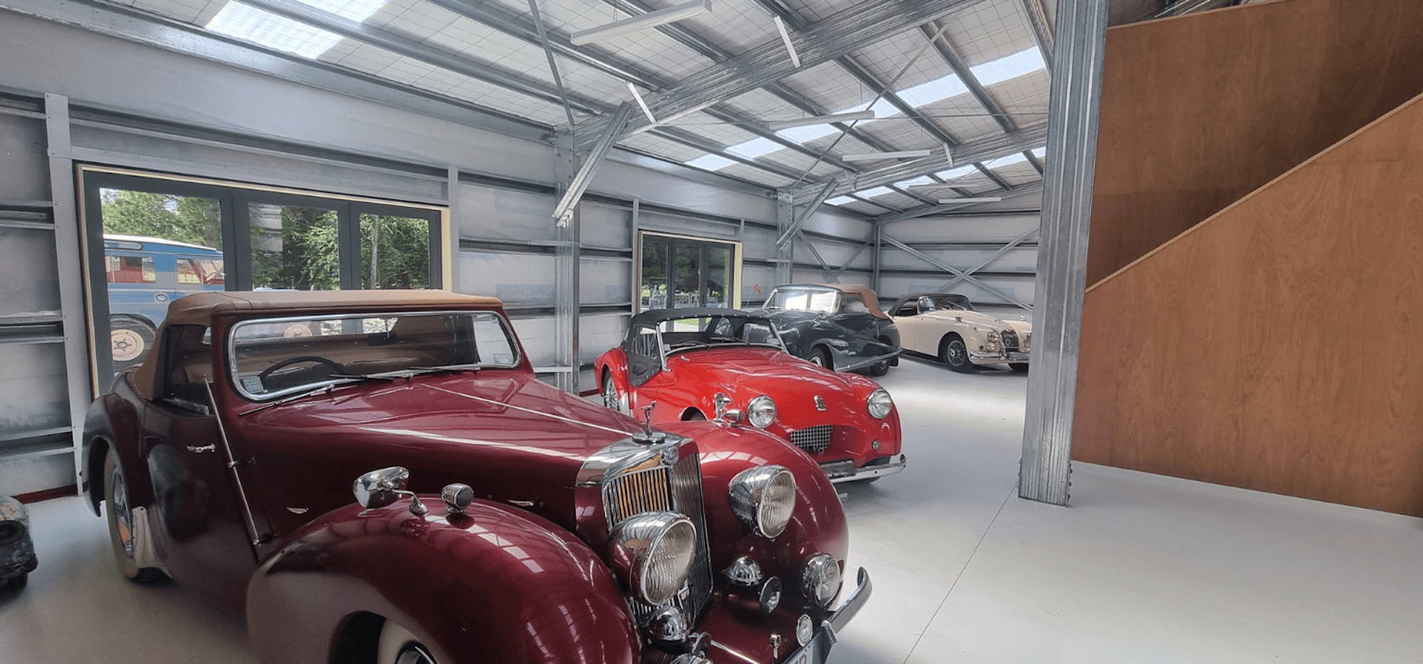 An American Barn with classic vehicles inside