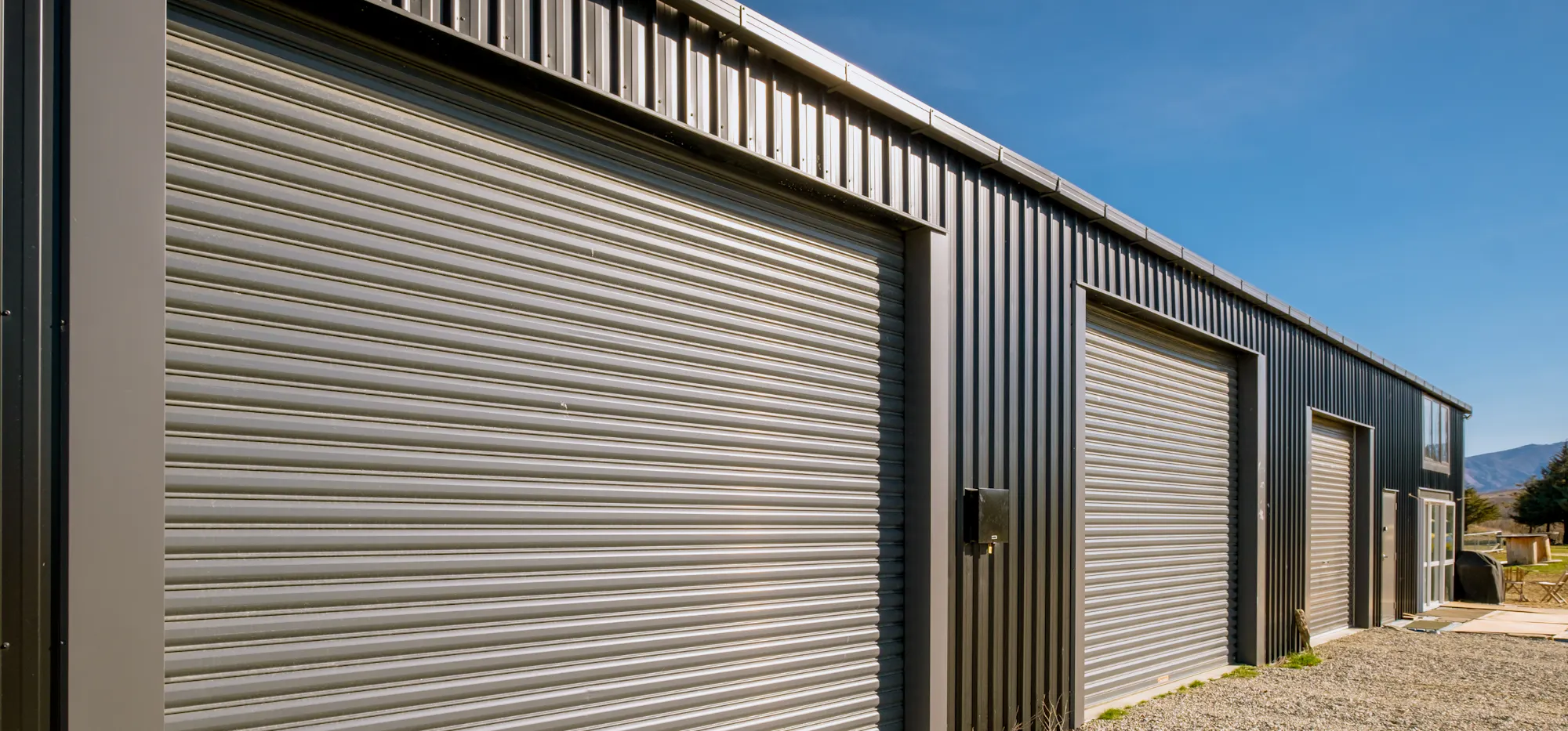 1.-NZ-Imagery Inspo-Gallery The-Shed-That-Ticks-Every-Box--Central-Otago 7-bay-shed-roller-doors