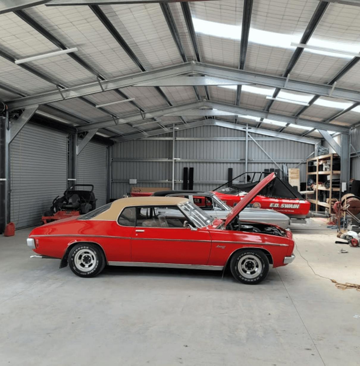 12x25 steel shed with cars inside - Wide Span Sheds