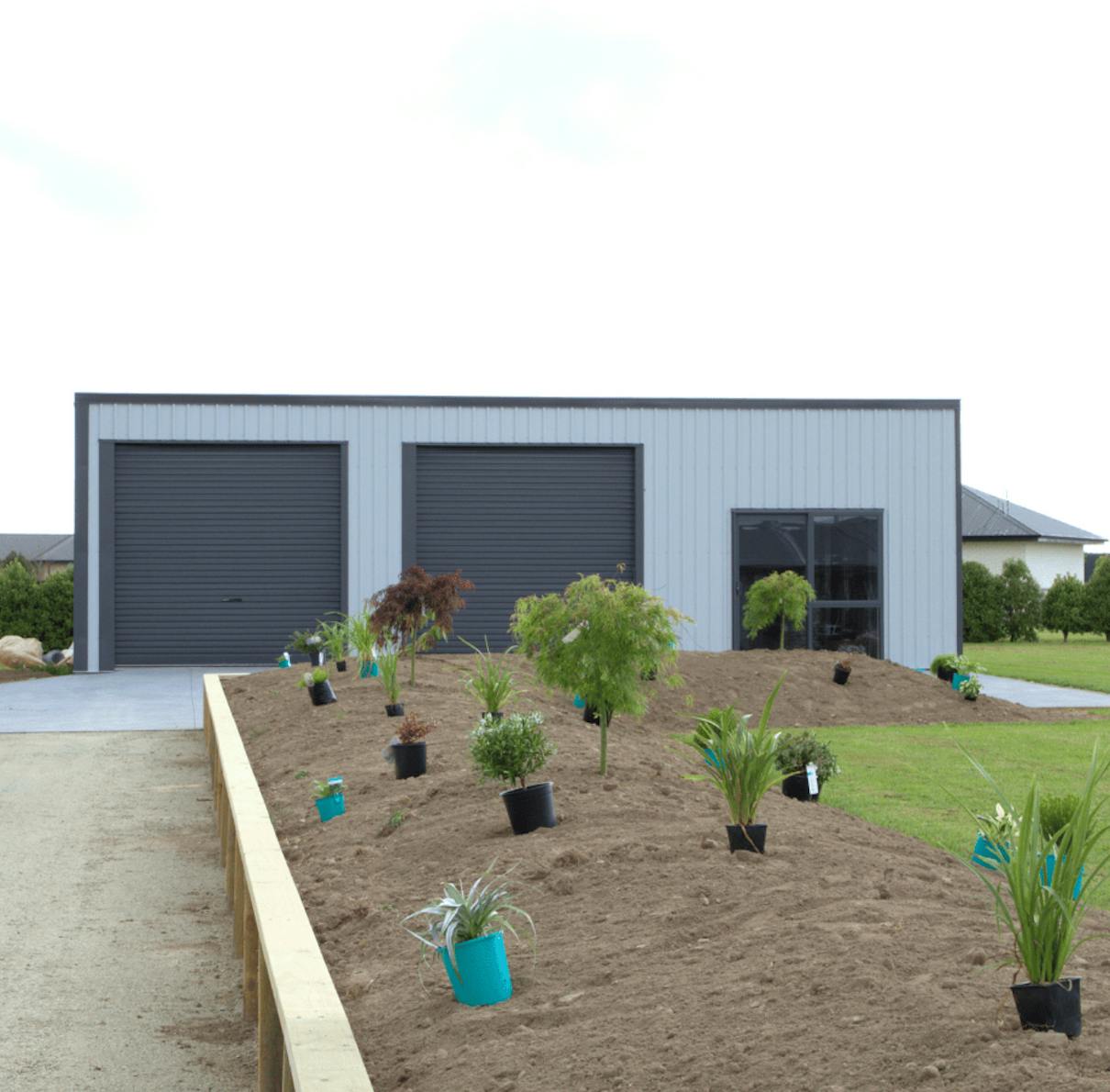 6x12 shed exterior shot with plants in foreground - Wide Span Sheds