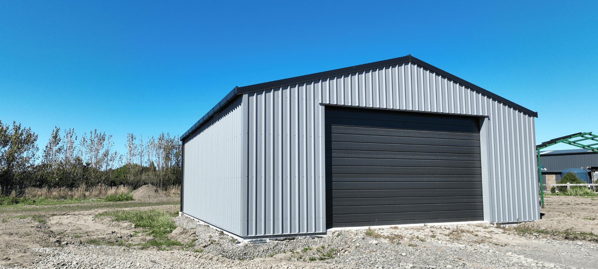 7x9 shed on blue sky day - Wide Span Sheds