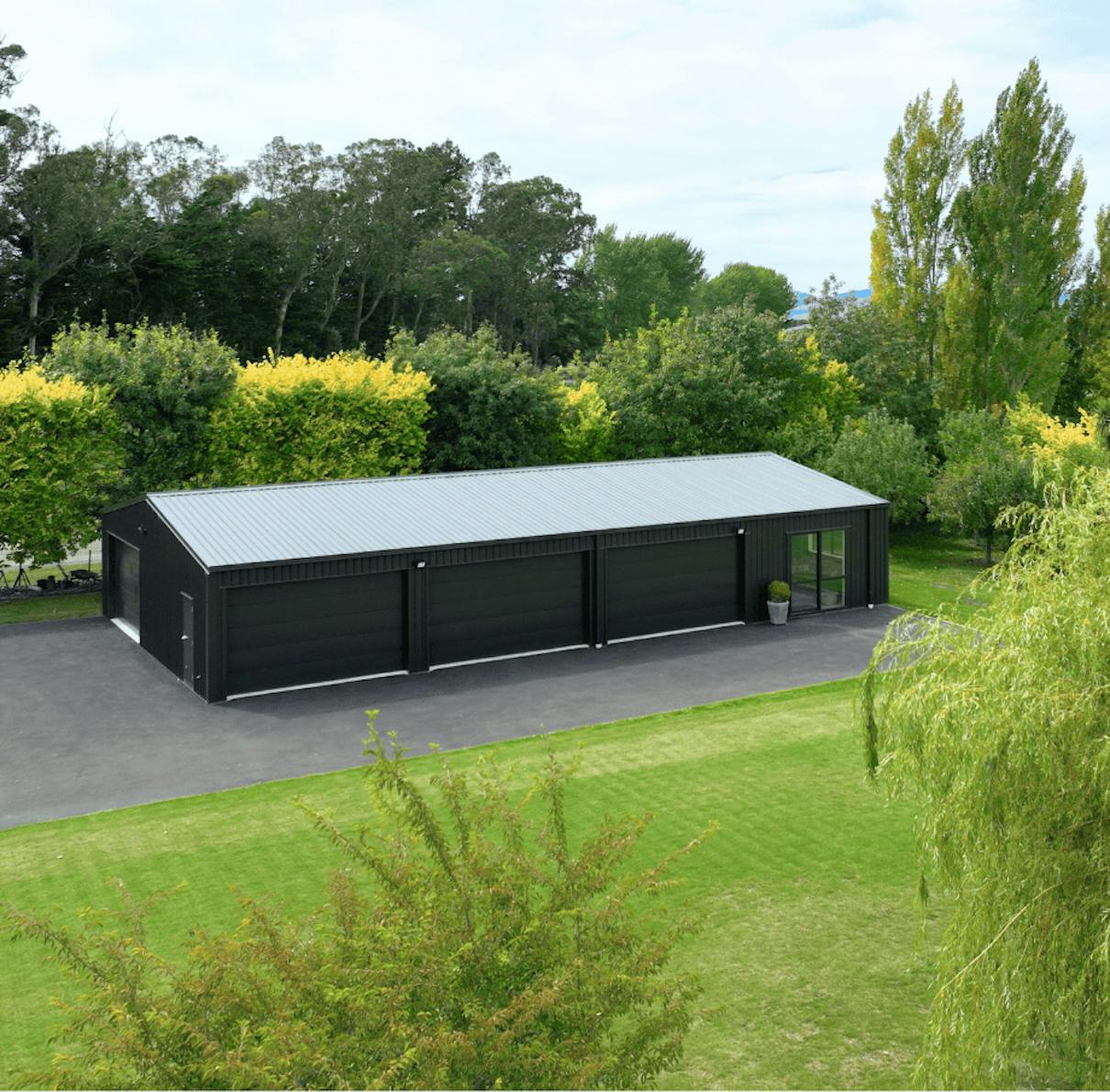 3 bay shed in a grass setting - Wide Span Sheds